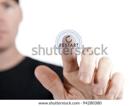 man touching a virtual restart button