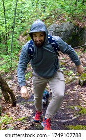 Man Tourist In A Hoody Hiking On A Trail In Quebec, Canada