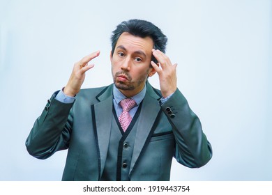 A Man With Tousled Hair In A Business Suit Straightens His Hair