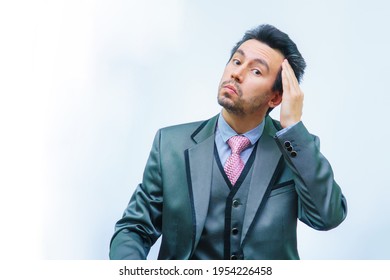 A Man With Tousled Hair In A Business Suit Straightens His Hair