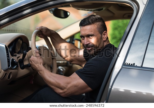 Man In A Track Suit
Driving In The Car