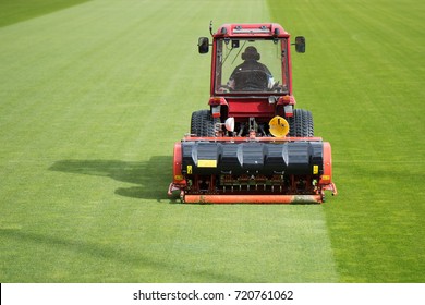 Man In Tractor Aerating A Soccer Field