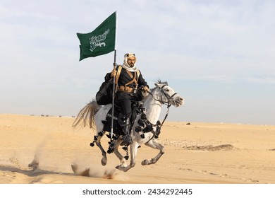 Man in traditional clothing with his horse in a desert - Powered by Shutterstock