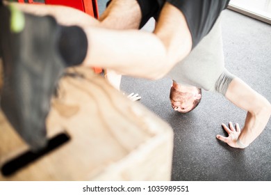 man training jumping box in front of window