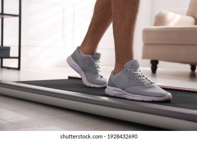 Man Training On Walking Treadmill At Home, Closeup