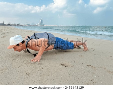 man training outdoors with a backpack with weights. Rucking as a popular form of exercise with weight on your back