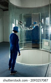 A Man Trains A Woman As An Astronaut. Classes On Flying In A Wind Tunnel.