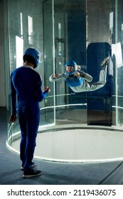 A Man Trains A Woman As An Astronaut. Classes On Flying In A Wind Tunnel.