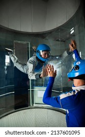 A Man Trains A Woman As An Astronaut. Classes On Flying In A Wind Tunnel.