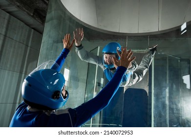 A Man Trains A Woman As An Astronaut. Classes On Flying In A Wind Tunnel.