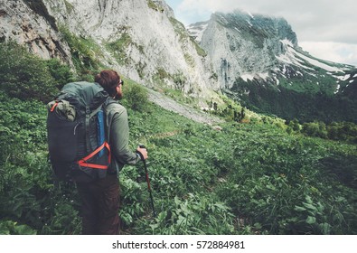 Man traveler with backpack hiking Travel Lifestyle concept adventure active  summer vacations outdoor rocky mountains on background