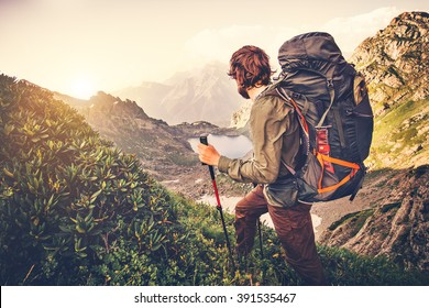 Man Traveler with backpack mountaineering Travel Lifestyle concept lake and mountains on background Summer expedition vacations outdoor  - Shutterstock ID 391535467