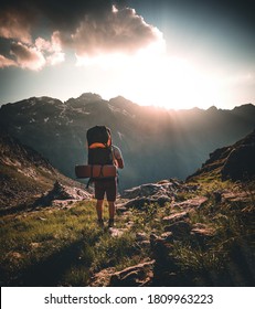 Man traveler hiking alone in breathtaking landscape of austrian Mounatins at sunset. Travel Lifestyle wanderlust adventure concept. Outdoor wilderness vacations. - Shutterstock ID 1809963223
