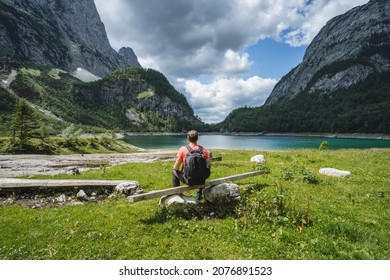 Man traveler on hiking trail to upper Gosau lake, Salzkammergut, Austria, Europe