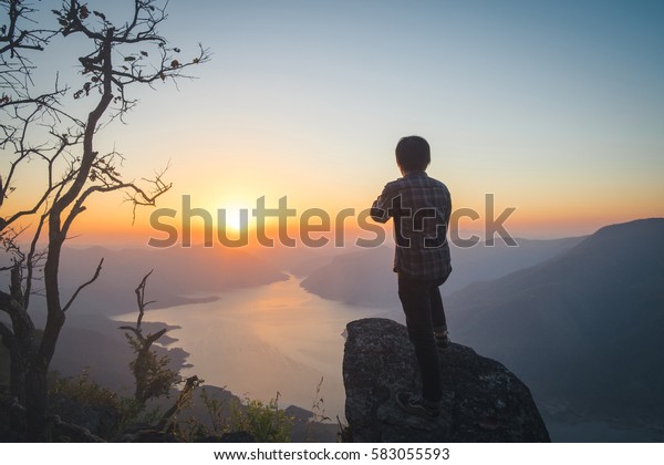 Man Traveler relaxing alone in Mountains Travel\
Lifestyle concept 