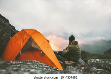 Man Traveler Relaxing In Mountains Near Of Tent Camping Gear Outdoor Travel Adventure Lifestyle Concept Hiking Active Vacations 