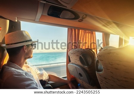A man traveling with a bus