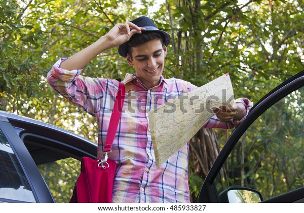 man traveling with the\
car and the map