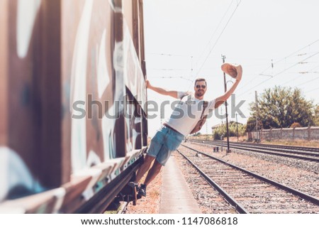 man traveling in train carriage