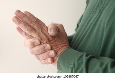 A Man Tries To Massage The Numbness Out Of His Hand