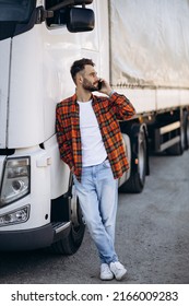 Man Trucker Talking On The Phone By His White Truck