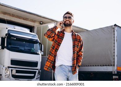 Man Trucker Talking On The Phone In The Truck Camp