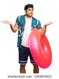 Man in trunks holding copyspace with two hands over isolated white background