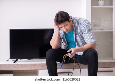 Man Trying To Fix Broken Tv