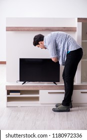 Man Trying To Fix Broken Tv