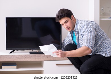 Man Trying To Fix Broken Tv