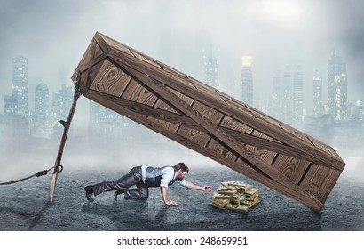 Man trying to get money in trap - Shutterstock ID 248659951