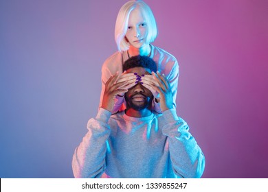 man trying to guess who is closing his eyes, nightmare, man having a dream, imagination concept , ghost, isolated purple background - Powered by Shutterstock