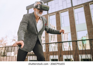 Man Trying To Keep Balance Playing A 3D Game Outside