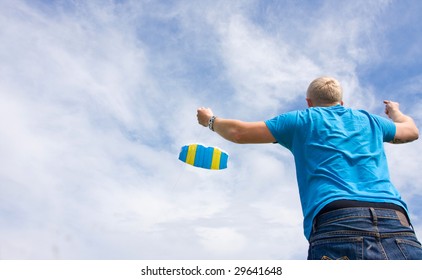 A man is trying to kite.