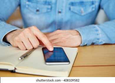 Man Trying To Log In Mobile Banking With Smartphone