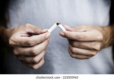 Man Trying To Quit Smoking. Conceptual Image. Close-up.