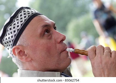 The Man In Tubeteika Smoking Hookah Outdoor