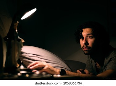 Man Turning Lights Off Before Bed