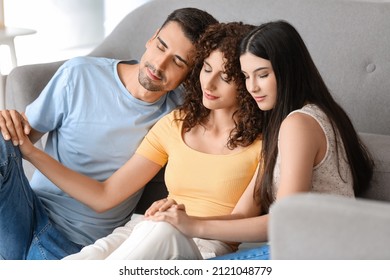 Man With Two Beautiful Women At Home. Polyamory Concept