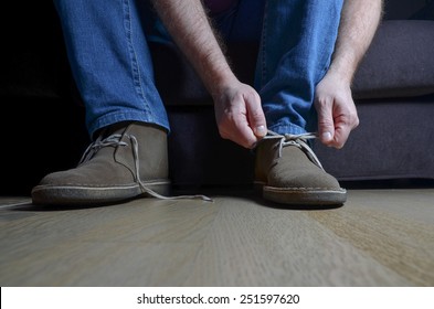 Man Tying Casual Shoes