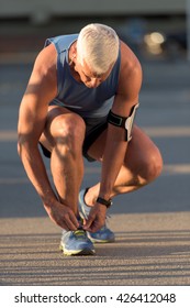 Man Tying Running Shoes Laces  Before Jogging Workout