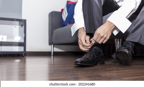 Man Tying Shoes