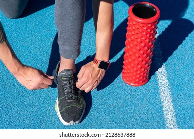 Man Tying Sneakers. Training Day. Sportswear