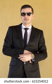 Man tying the suit button