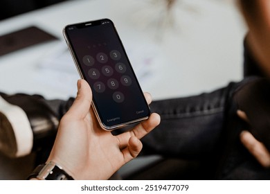 Man typing his phone passcode. Man with smartphone. Photo of business man using mobile phone, digital device gadget. Closeup of man holding mobile phone, showing smartphone screen passcode