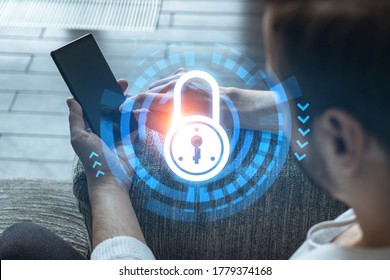 A Man Typing Mobile Phone. Double Exposure. Lock Icon Hologram. Protection Of Data Information Concept.