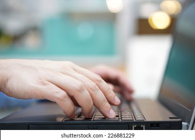 Man Is Typing On Laptop Keyboard  Shallow Depth Of Field