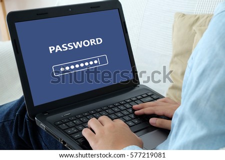 Man typing password on labtop screen background, cyber security concept