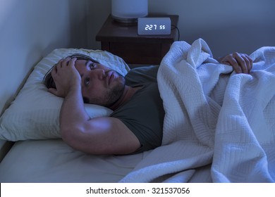 A Man Unable To Fall Asleep In Bed