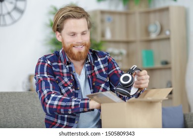 A Man Unboxing Wireless Headphones